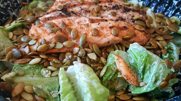 Low Carb Caesar Salad with Salmon and Pumpkin Seeds