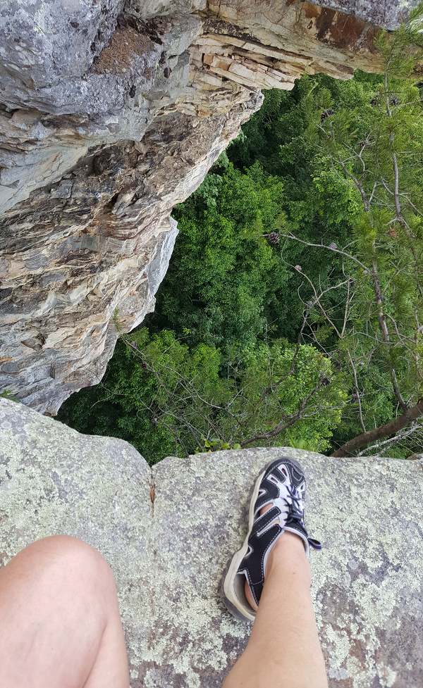 Sitting on the edge of the cliff at Savage Gulf