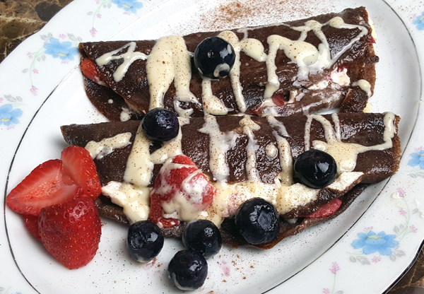 Low Carb Crepes - Stuffed with Cream Cheese and Strawberries, topped with Blueberries and Sugar Free White Chocolate Drizzle